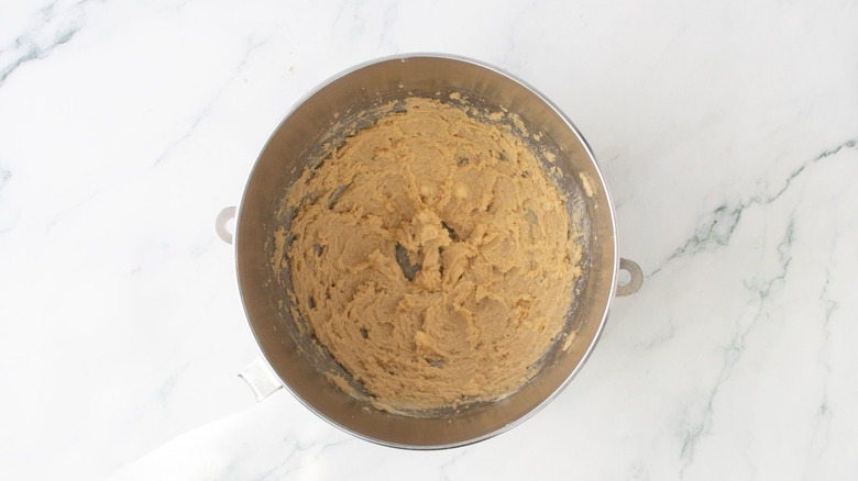Beaten butter and brown sugar in bowl