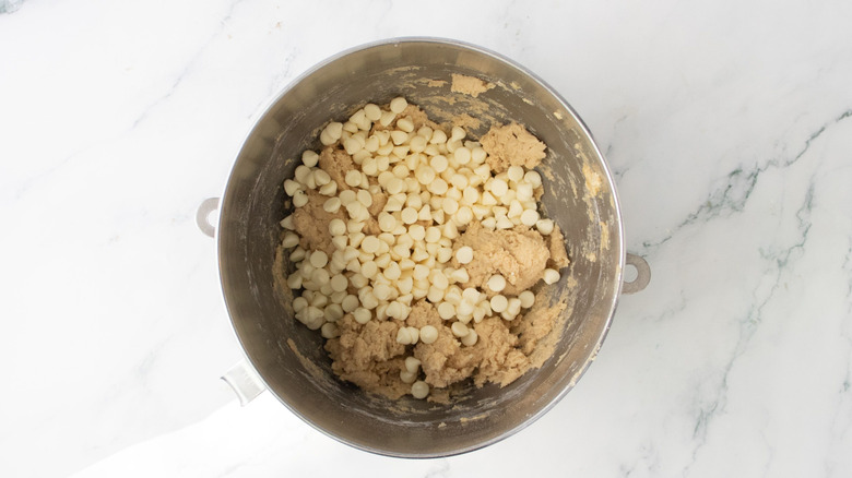 Cookie dough and white chocolate chips in bowl