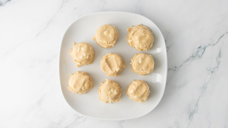 Large cookie dough portions on plate