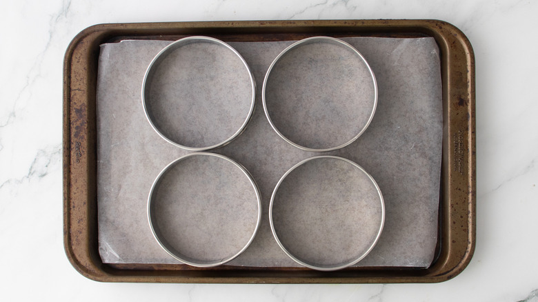 four wing molds on baking sheet