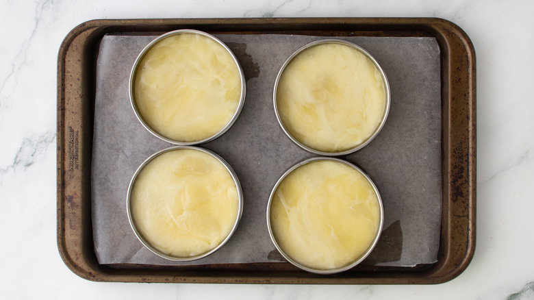 melted cheese curds in four ring molds