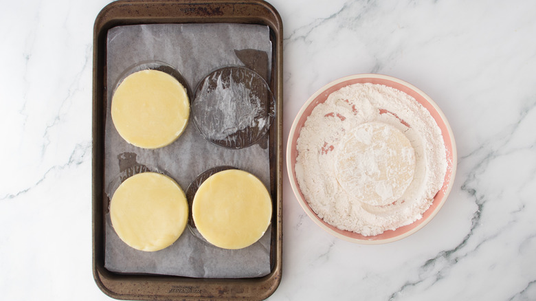 coating cheese patty in flour