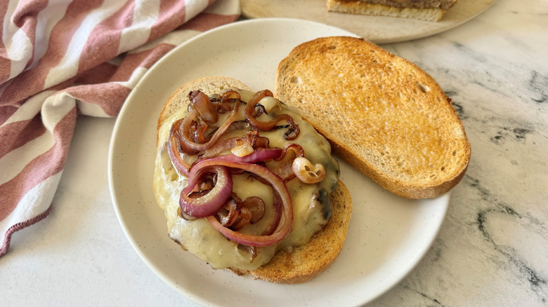Open faced Wisconsin Swiss melt with grilled onions