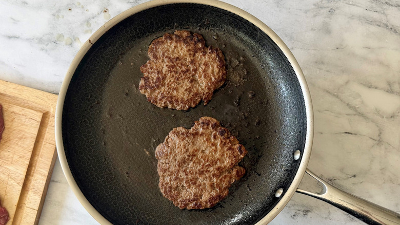 Beef patties in skillet