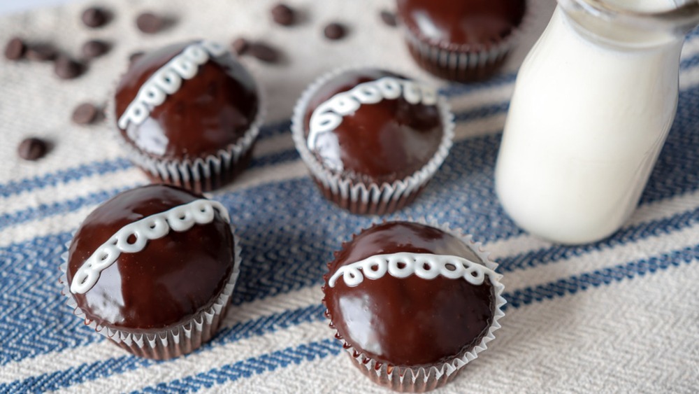 copycat Hostess cupcakes with milk in bottle on striped towel
