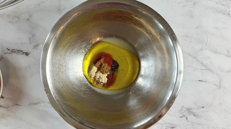 Olive oil and spices in bowl