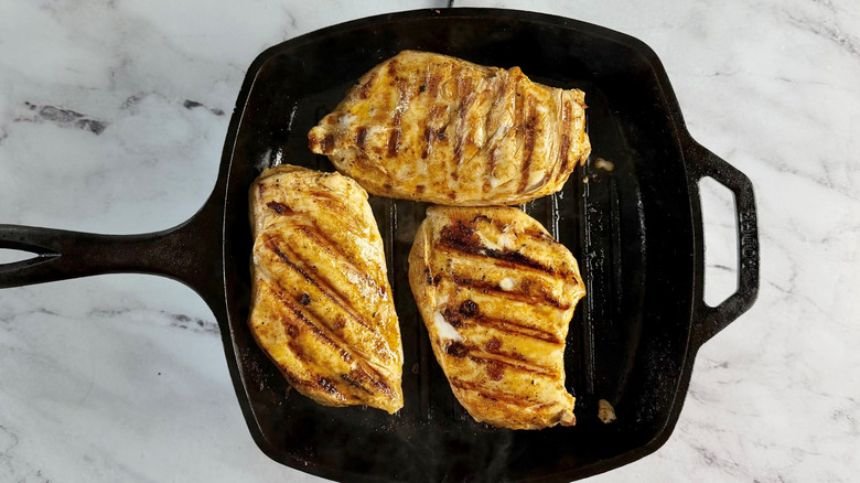Grilled chicken breasts in grill pan