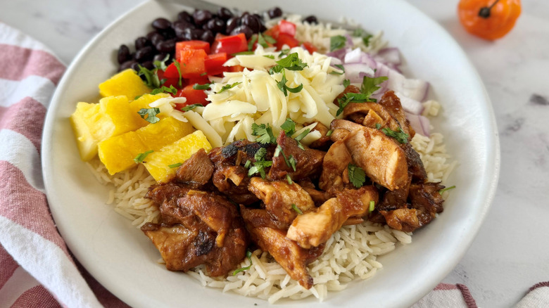 Hawaiian chicken burrito bowl with various toppings
