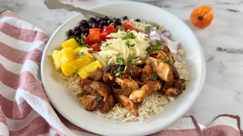 Hawaiian chicken burrito bowl with various toppings