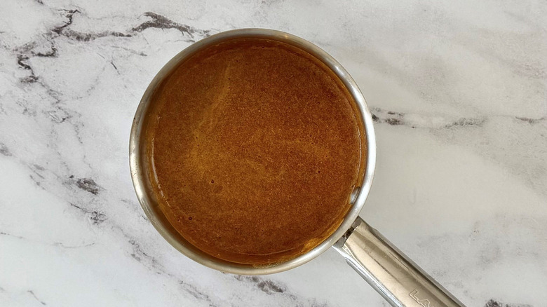 Dark sauce in saucepan