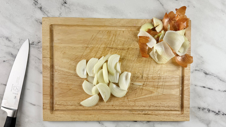 chopped onions on a wooden board