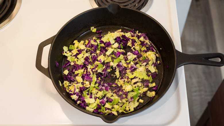 cabbage cooking in iron pan