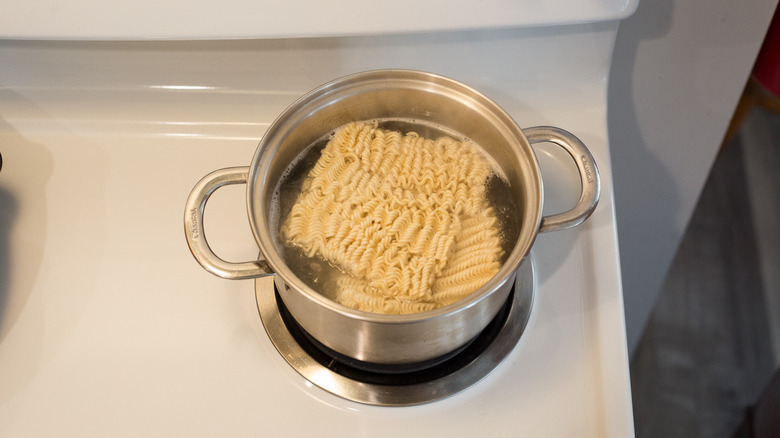 ramen noodles boiling on stove