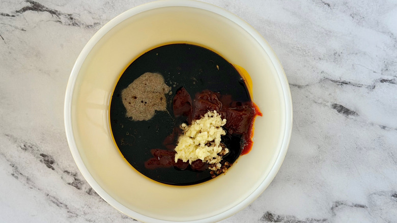 soy sauce and seasonings in a white bowl