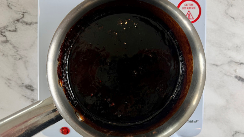 brown liquid in a metal pot