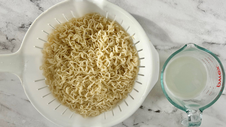 ramen noodles in a white colander