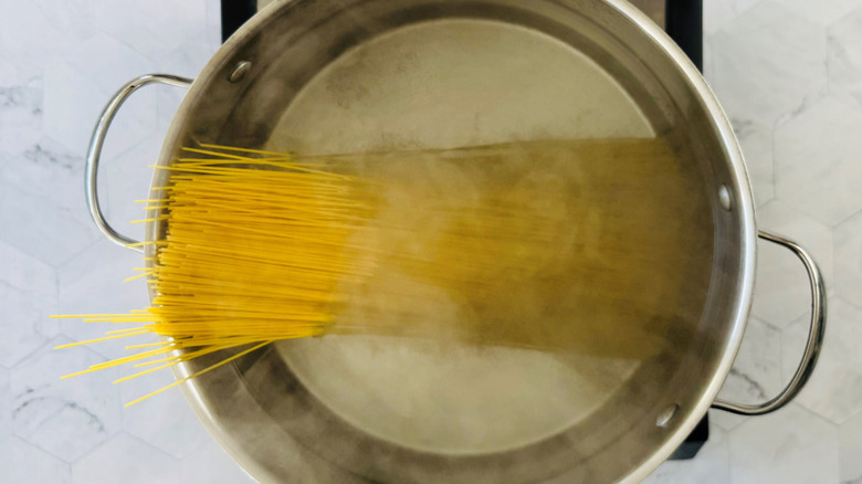 Angel hair pasta in pot of boiling water
