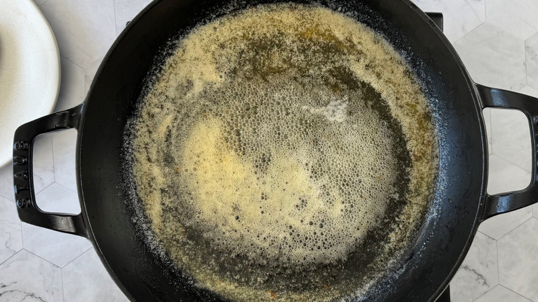 Aerial view of lightly browned butter in large pan