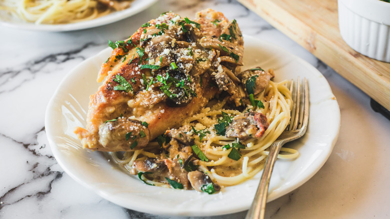 chicken and spaghetti on plate