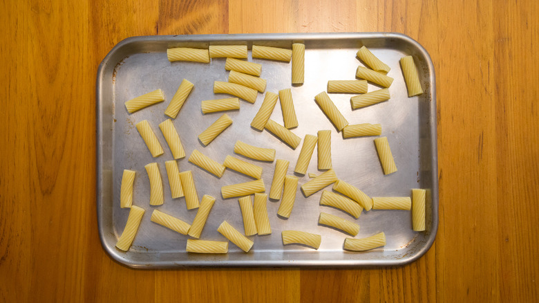 rigatoni pasta on baking sheet
