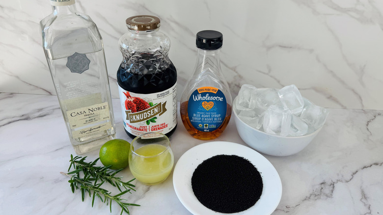 ingredients for a pomegranate margarita with black salt