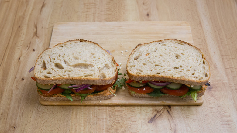 veggie sandwiches on wooden board