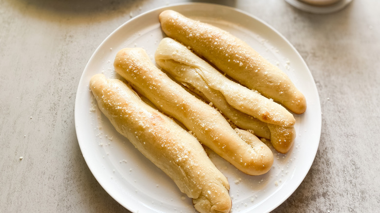 breadsticks served on a plate