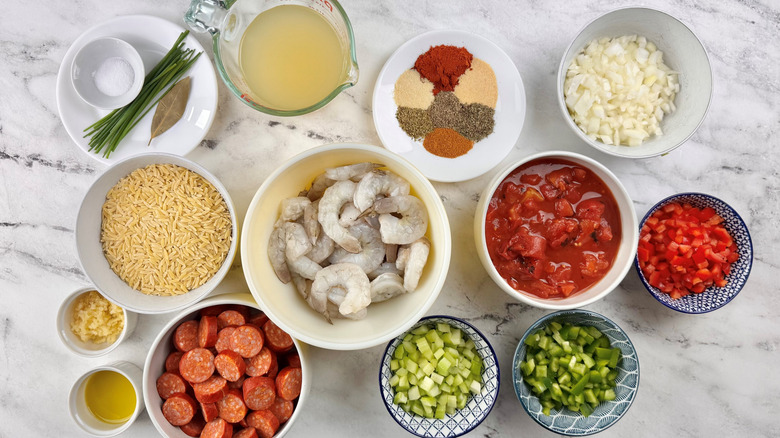 shrimp, sausage, pasta, broth, vegetables, and spices