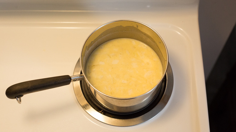 white sauce in small saucepan