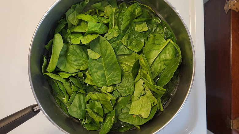 spinach in pot of water