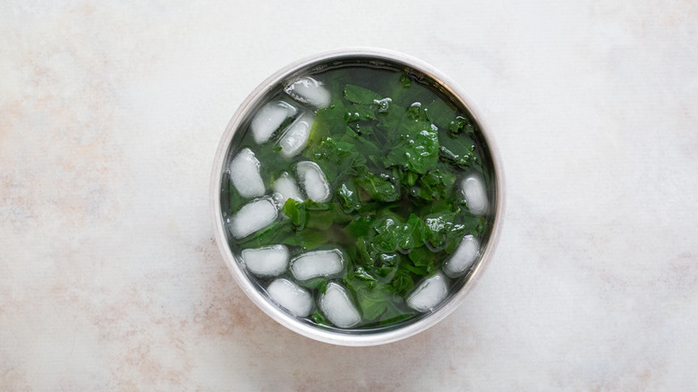 spinach in ice water bowl