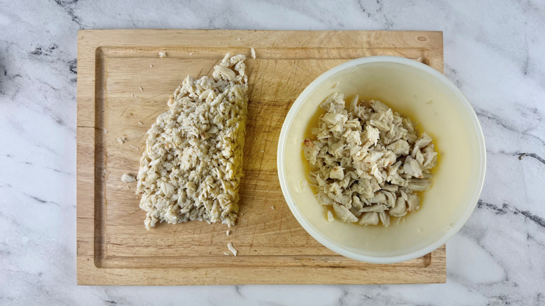 Crab meat on cutting board and in bowl