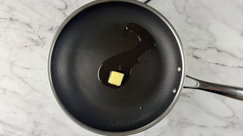 Oil and pat of butter in pan