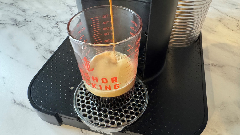 Nespresso machine dispensing coffee