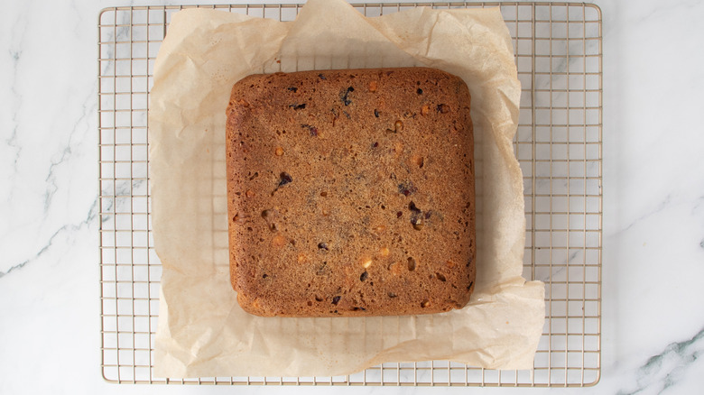 uncut bar cookie on paper on a wire rack