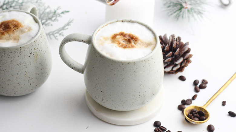 mugs with fresh coffee drinks