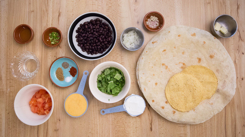 Taco Bell black bean Crunchwrap ingredients on table