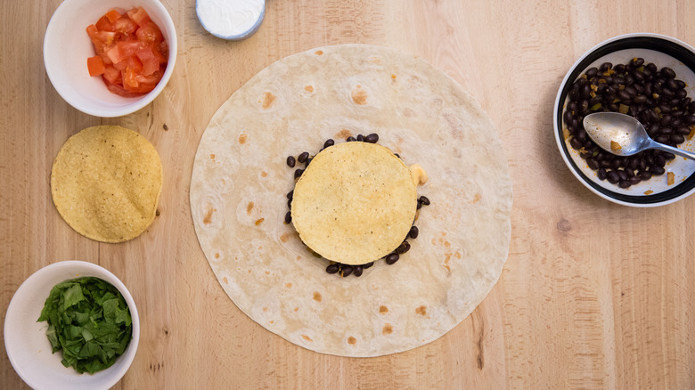 partially made Crunchwrap on table