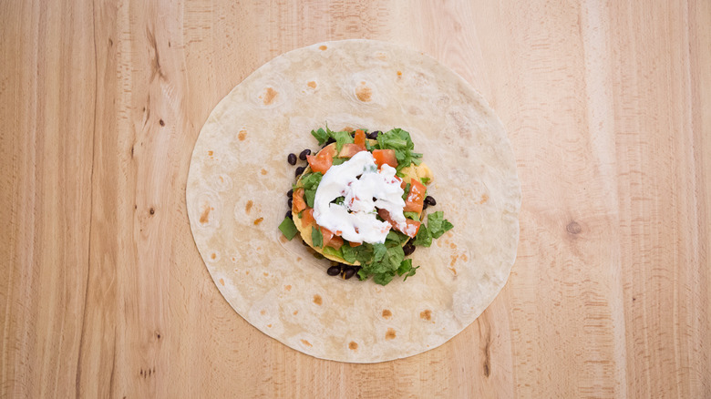 partially made Crunchwrap on table