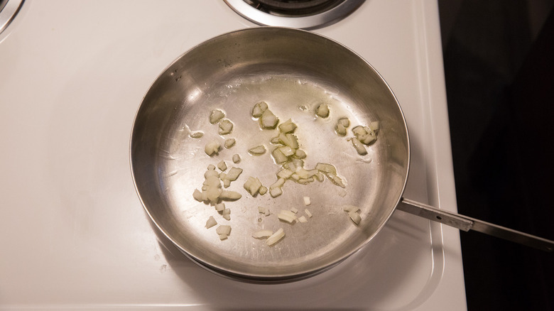 onion cooking in stovetop pan