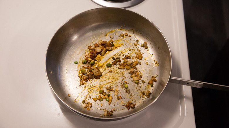 spiced onions cooking in pan