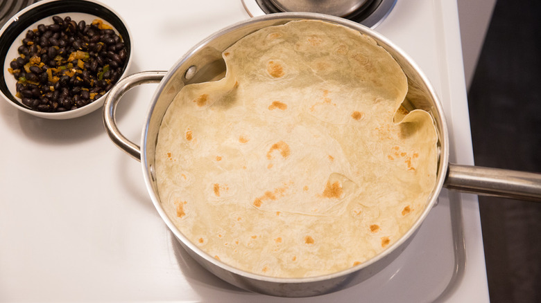 tortilla warming in large pan