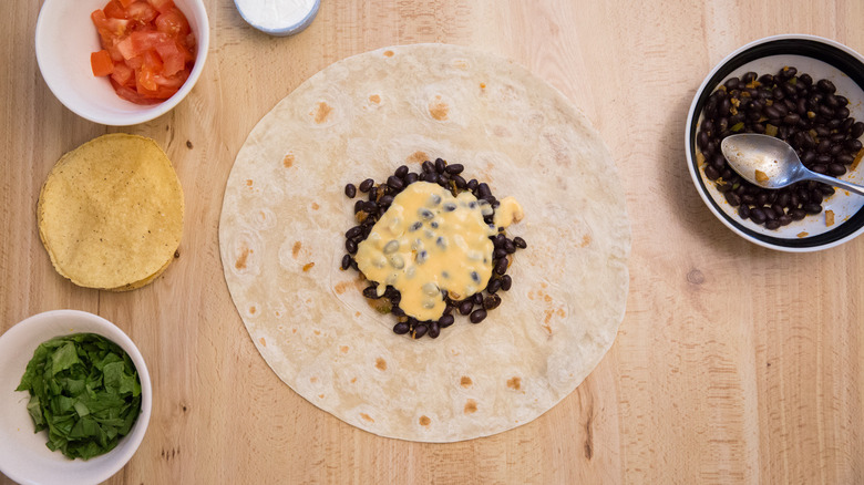 partially made Crunchwrap on table