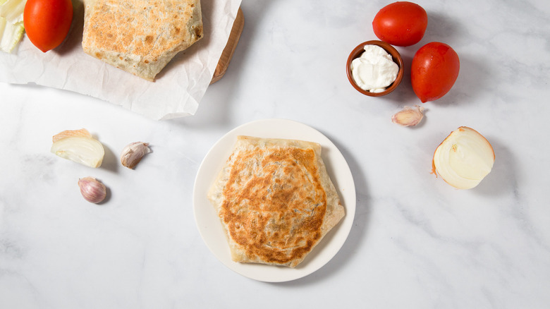 Crunchwraps served on marble table