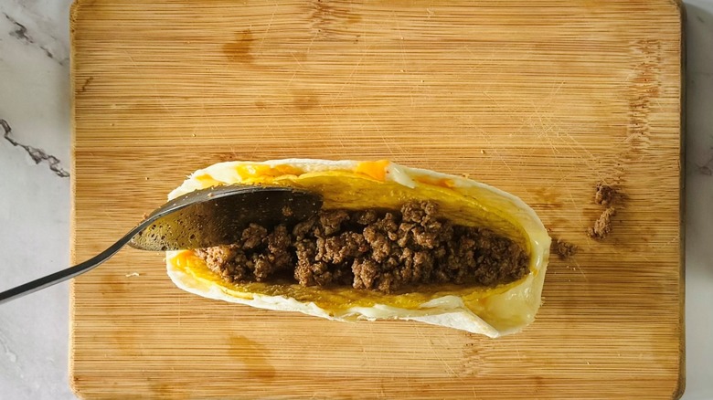 tortilla-wrapped taco with ground beef