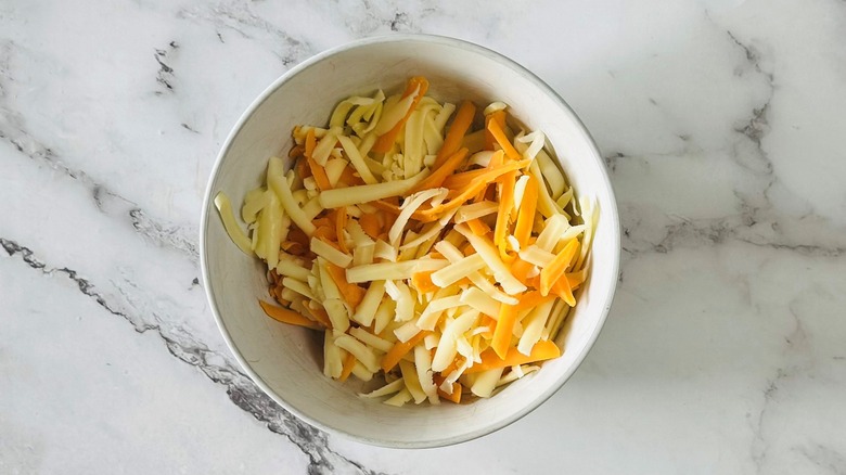 shredded cheese in a white bowl