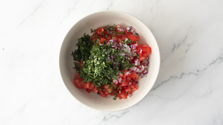 Pico de gallo ingredients unmixed in bowl