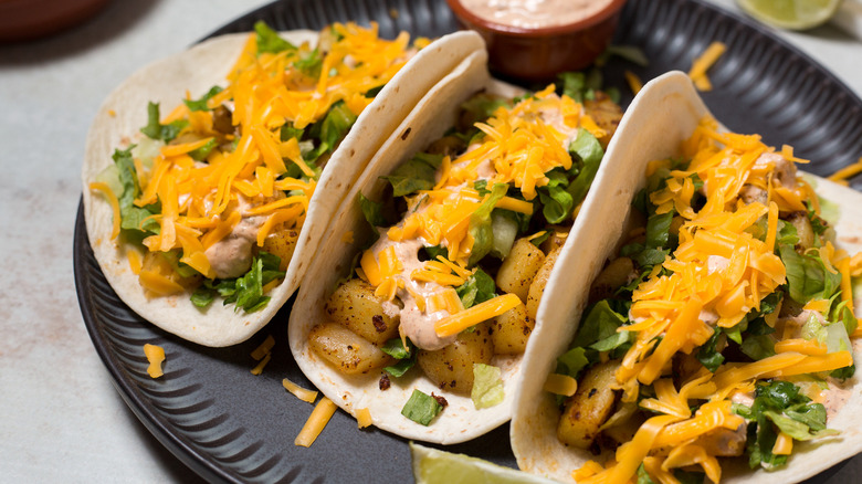 three colorful tacos on plate