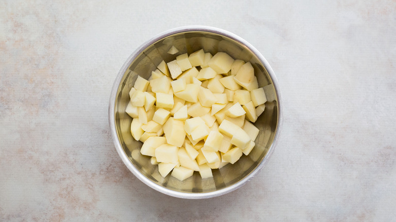 cubed potatoes in mixing bowl