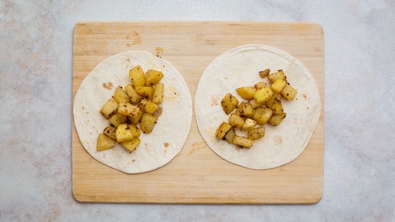 potato tacos on wooden board